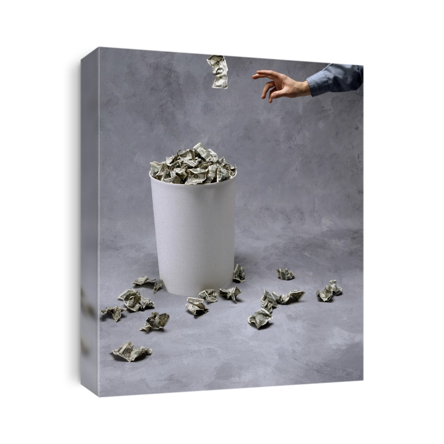 Throwing US currency into a bin. Conceptual image of US dollar bills (USD) being thrown away, representing concepts such as financial waste and missing economic targets.